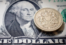Pound soars against dollar and euro as rate hike looms